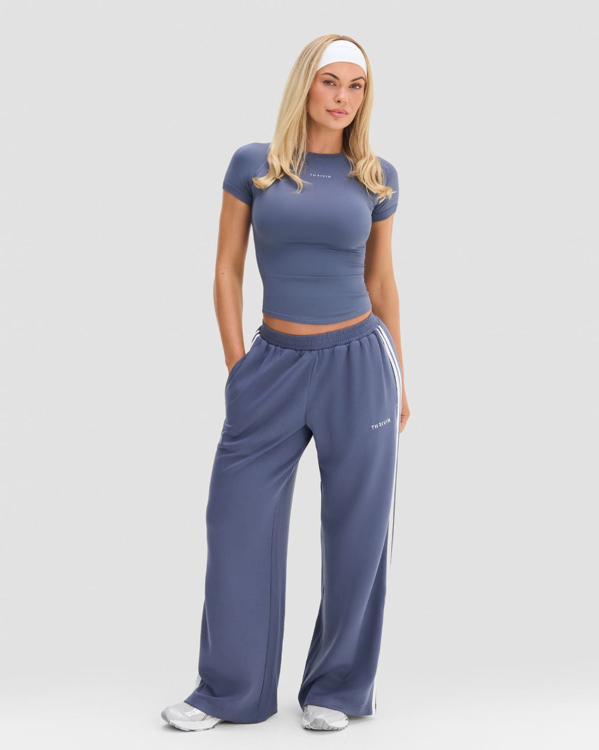 Elevate Compression T-Shirt in Steel Blue, full-length front view as a cropped gym T-shirt with wide leg joggers