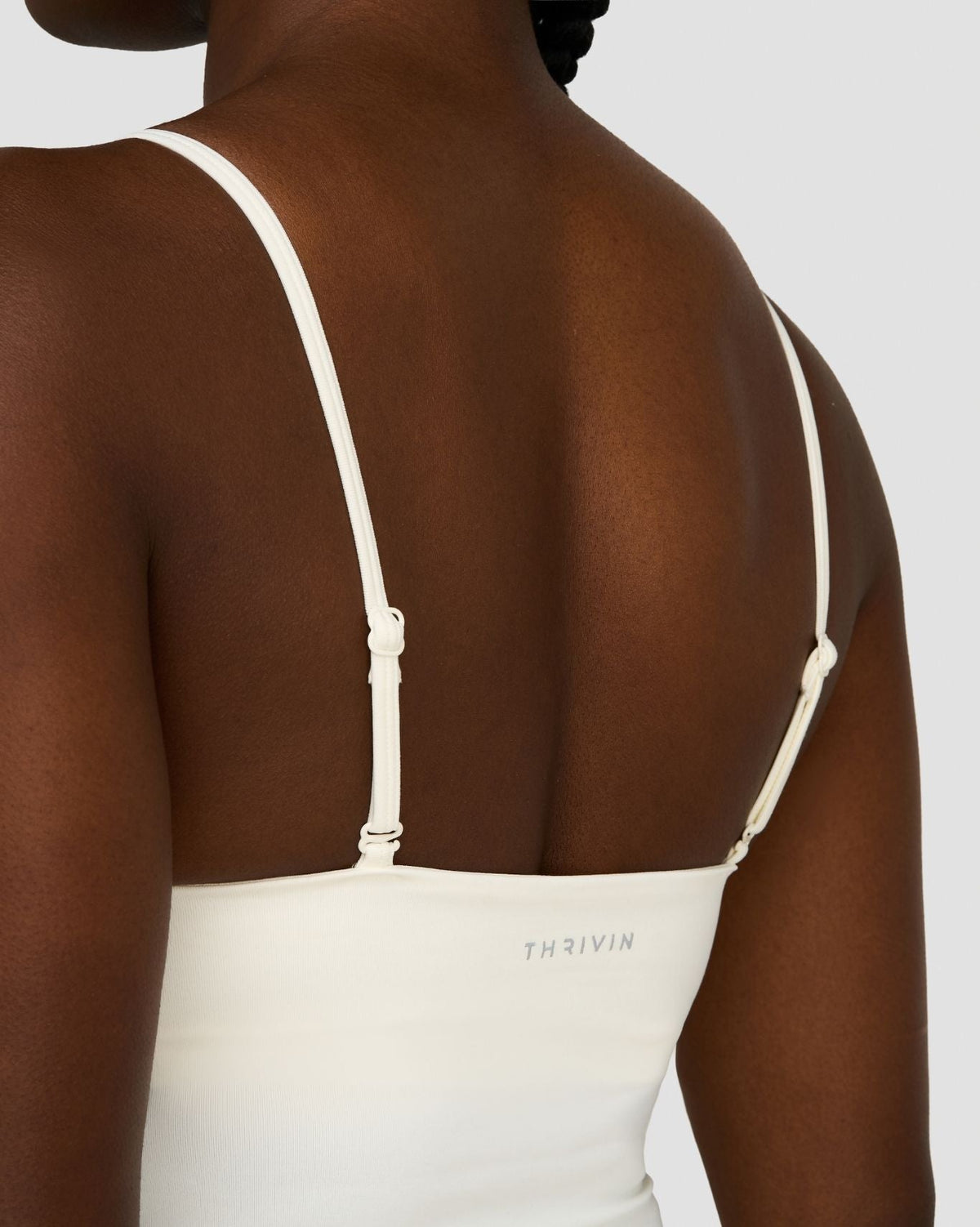 Elevate Sculpting Seamless Scoop Neck Cami in Cream, back close-up of straps and THRIVIN logo