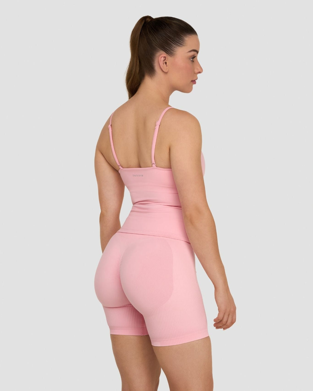 Elevate Sculpting Seamless Scoop Neck Cami in Cotton Pink, back three-quarter view with thin straps and matching shorts