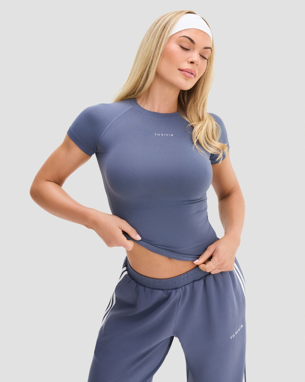 Elevate Compression T-Shirt in Steel Blue, front view of snug cropped fit, raglan sleeves and stitched hem