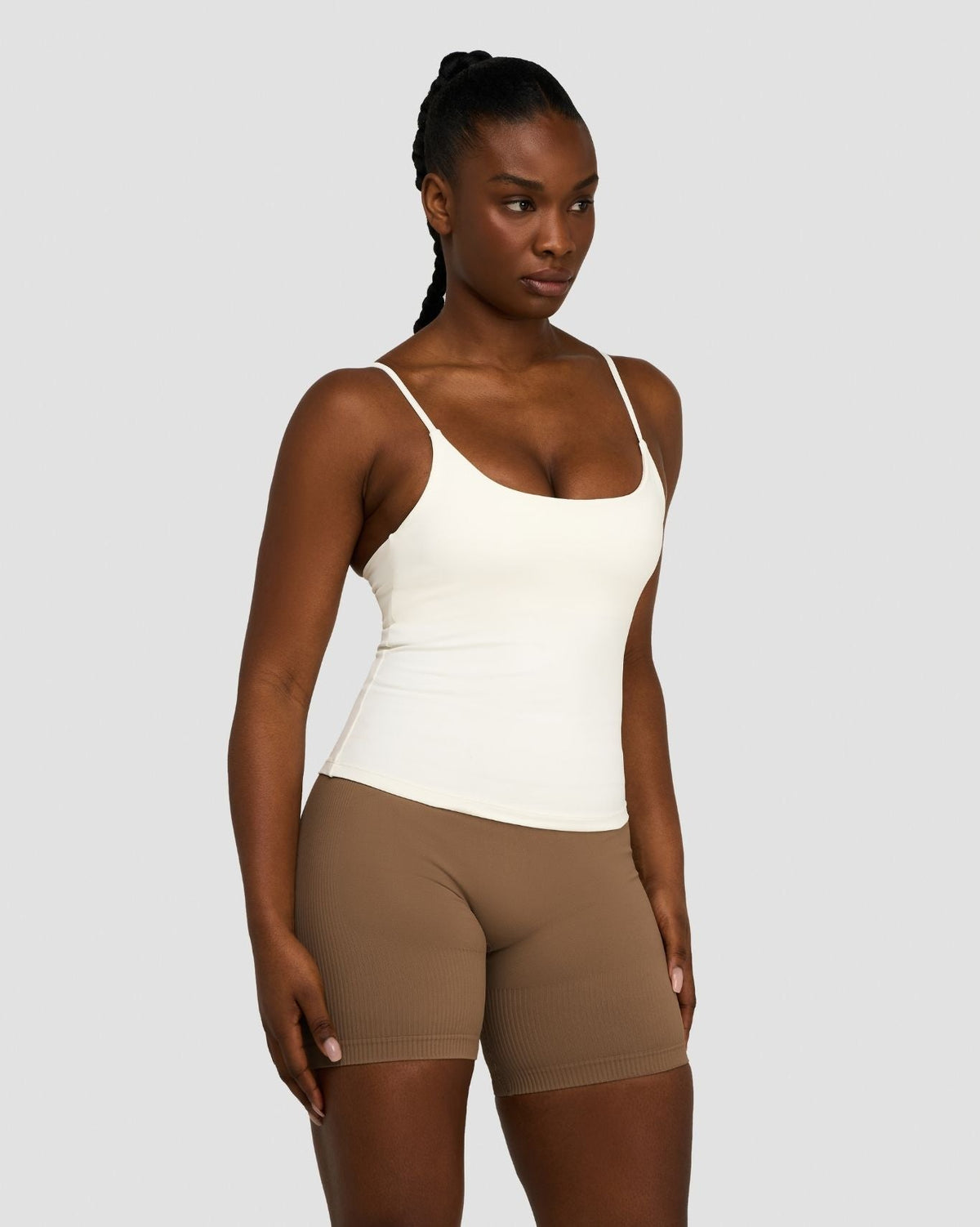 Elevate Sculpting Seamless Scoop Neck Cami in Cream, front view styled with brown shorts