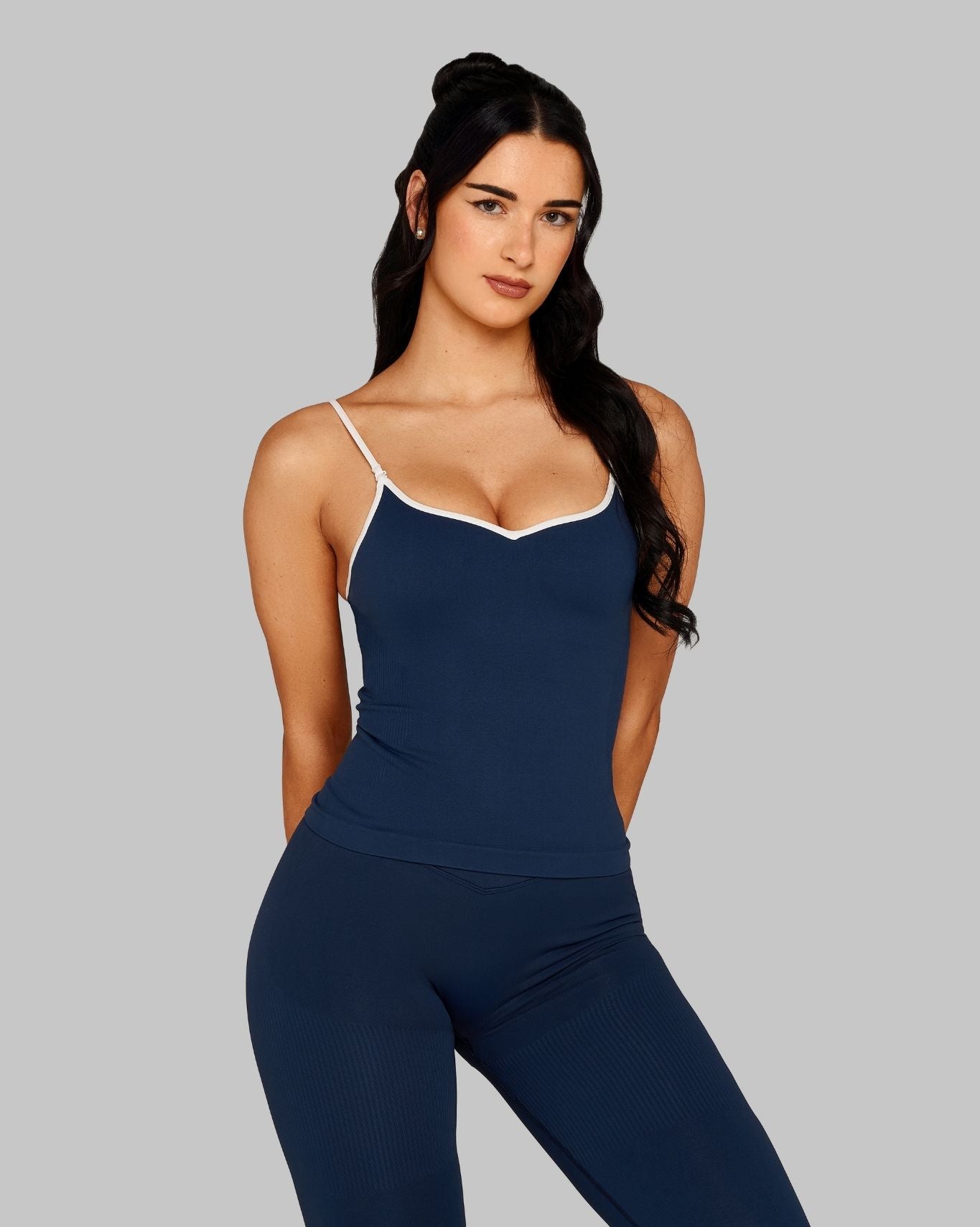 Bliss is 5’10” and wears a size XS.