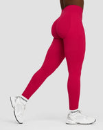 Elevate Sculpting Mid Waist Scrunch Leggings in Strawberry, side-back view mid-stride, with white sneakers