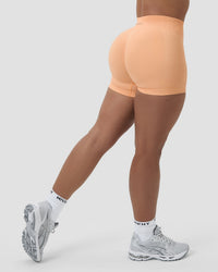 Elevate™ Sculpting Mid Waist Scrunch Shorter Shorts | Melon