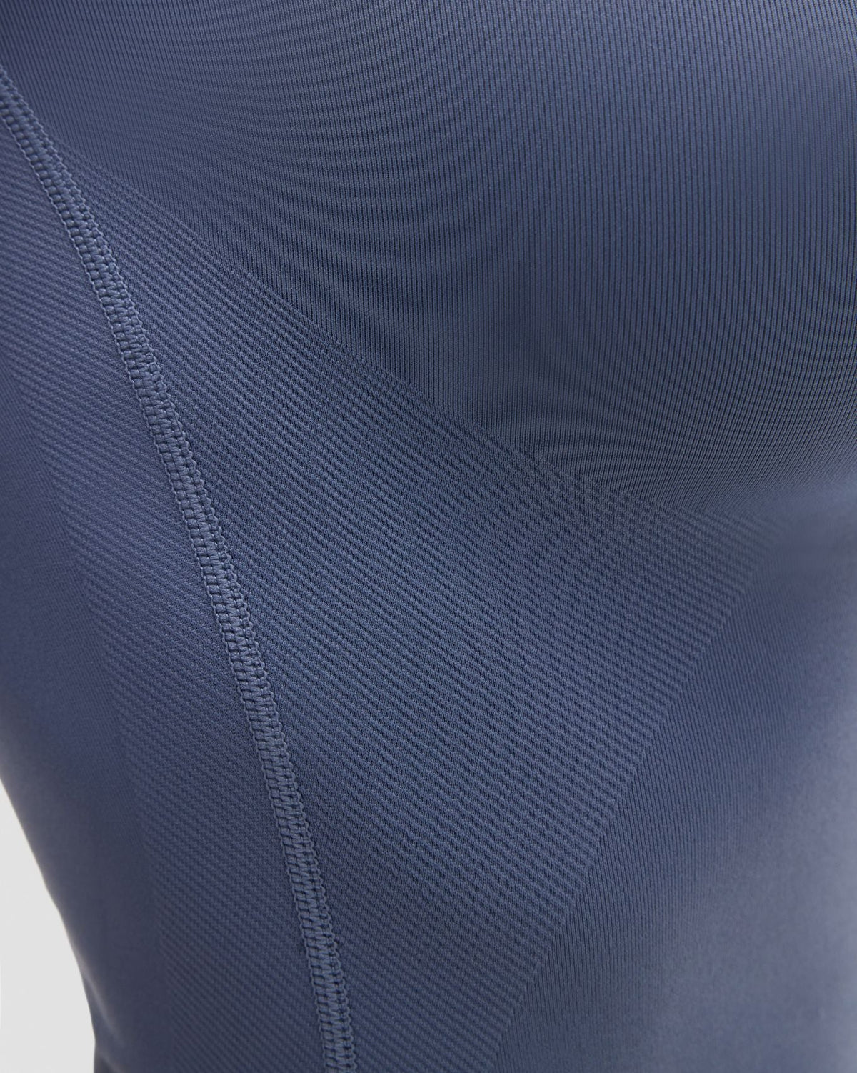 Elevate Compression T-Shirt in Steel Blue, close-up of ribbed knit texture with diagonal rib panel and stitched seam