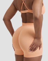 Elevate™ Sculpting Mid Waist Scrunch Shorter Shorts | Melon