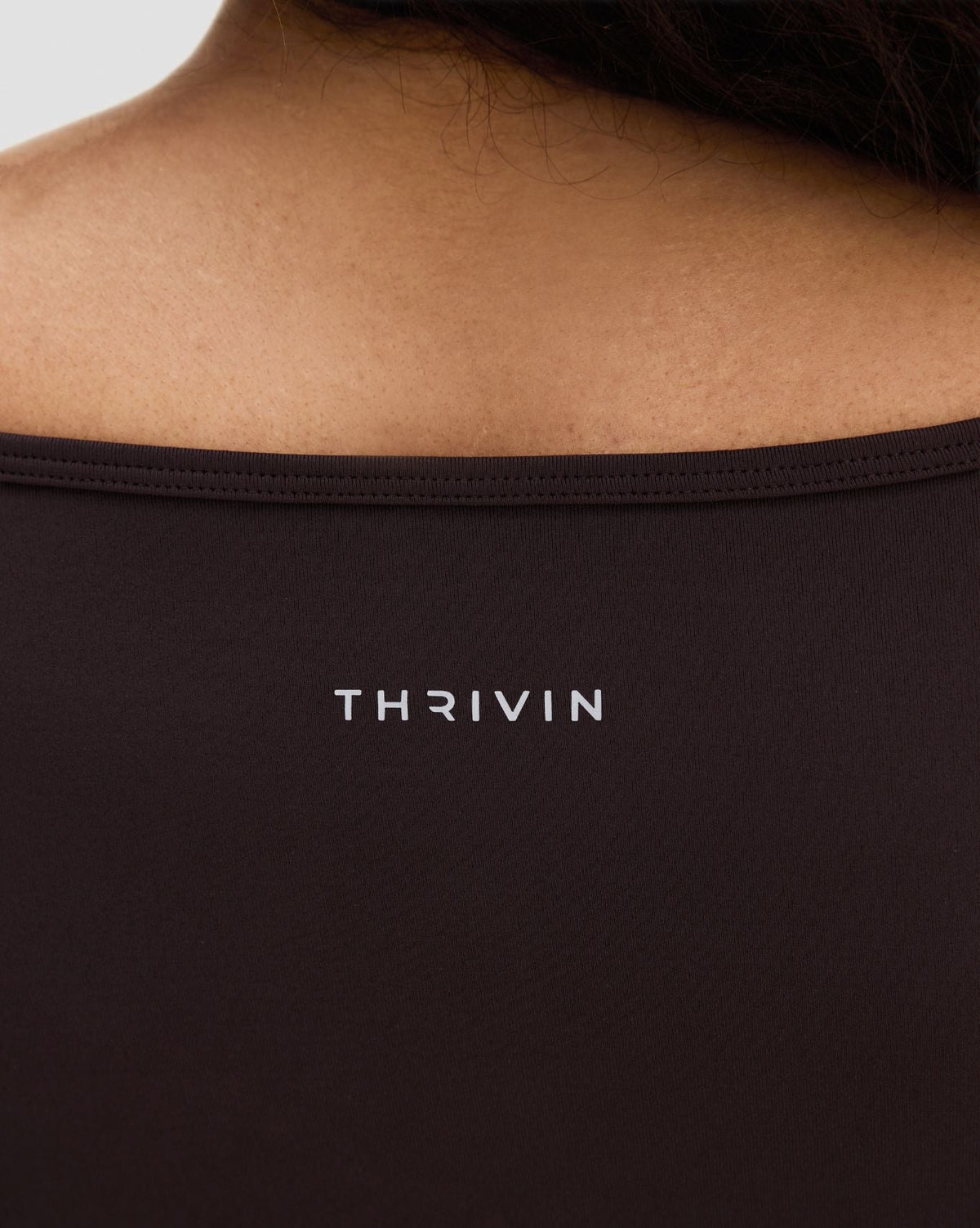 Elevate Sculpting Seamless V-Neck Top in Coffee Brown, back close-up of neckline and THRIVIN logo