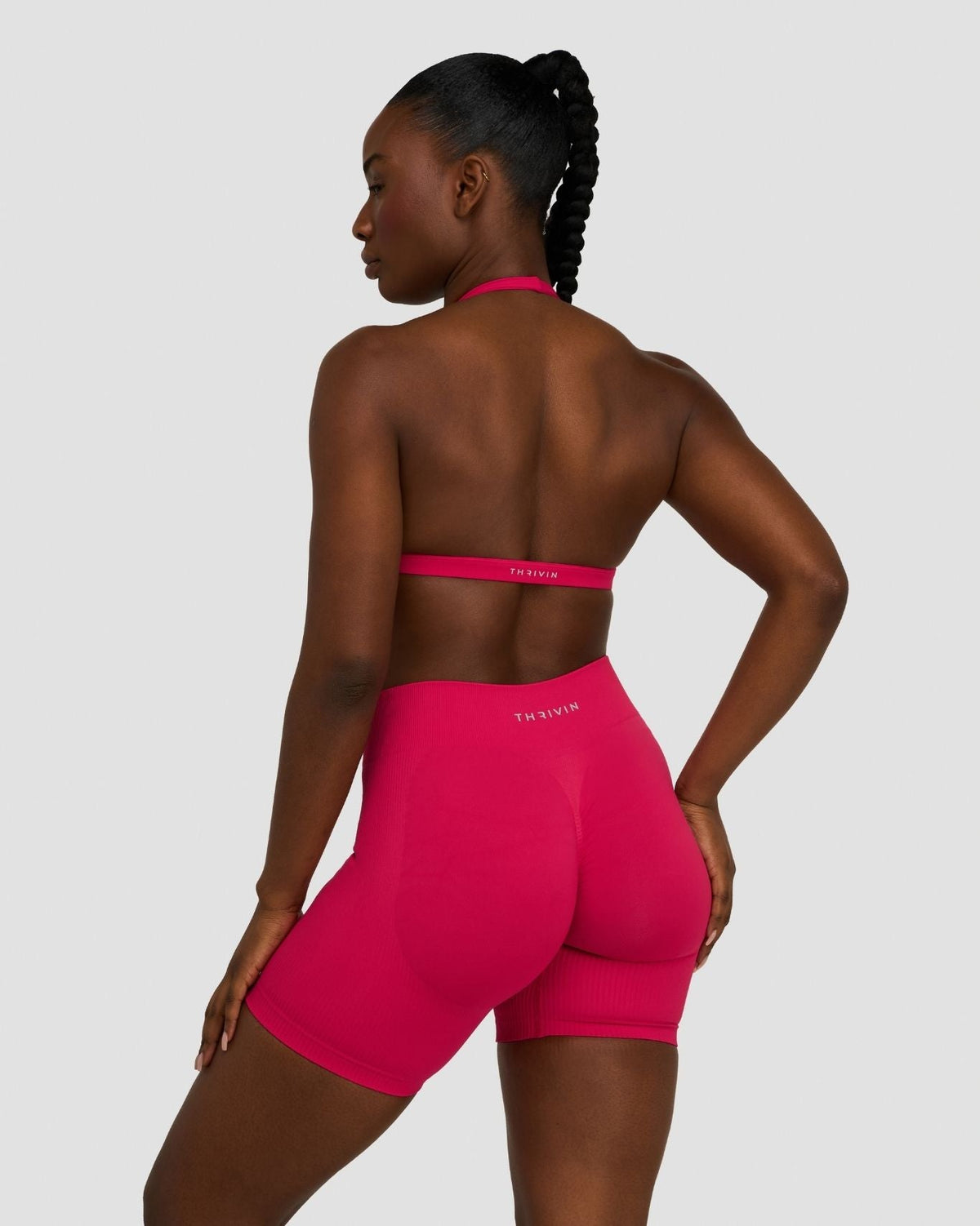 Elevate Sculpting Seamless V-Neck Halter Bra in Strawberry, back view of open back, styled with matching shorts