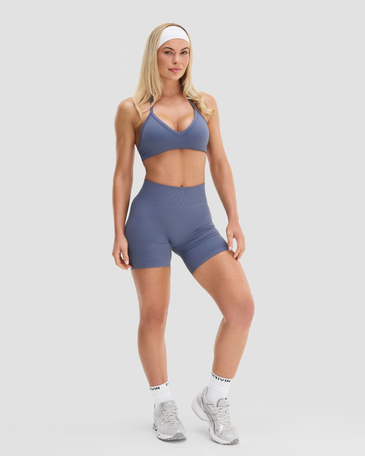 Elevate Sculpting Seamless Adjustable Halter Bra in Steel Blue, full-length front view of halter fit with matching shorts
